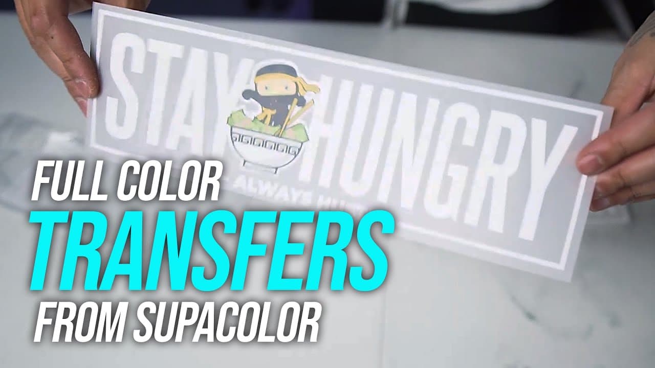 Person holding full color heat transfer with ninja design from Supacolor on garment