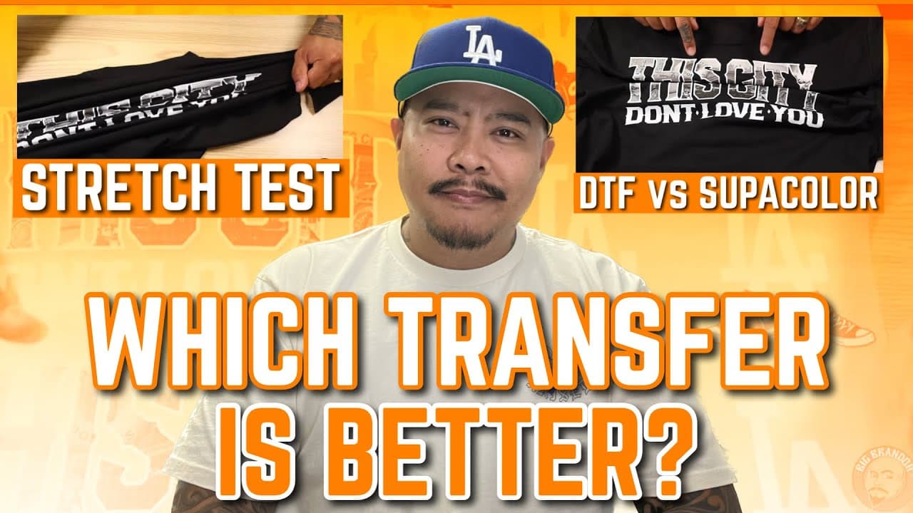 Man comparing Supacolor and SupaDTF transfer methods through stretch test and color durability demonstration