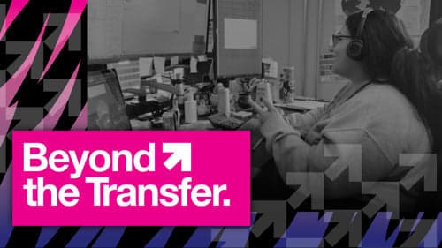 Person wearing headphones providing customer support at desk with heat transfer equipment and materials